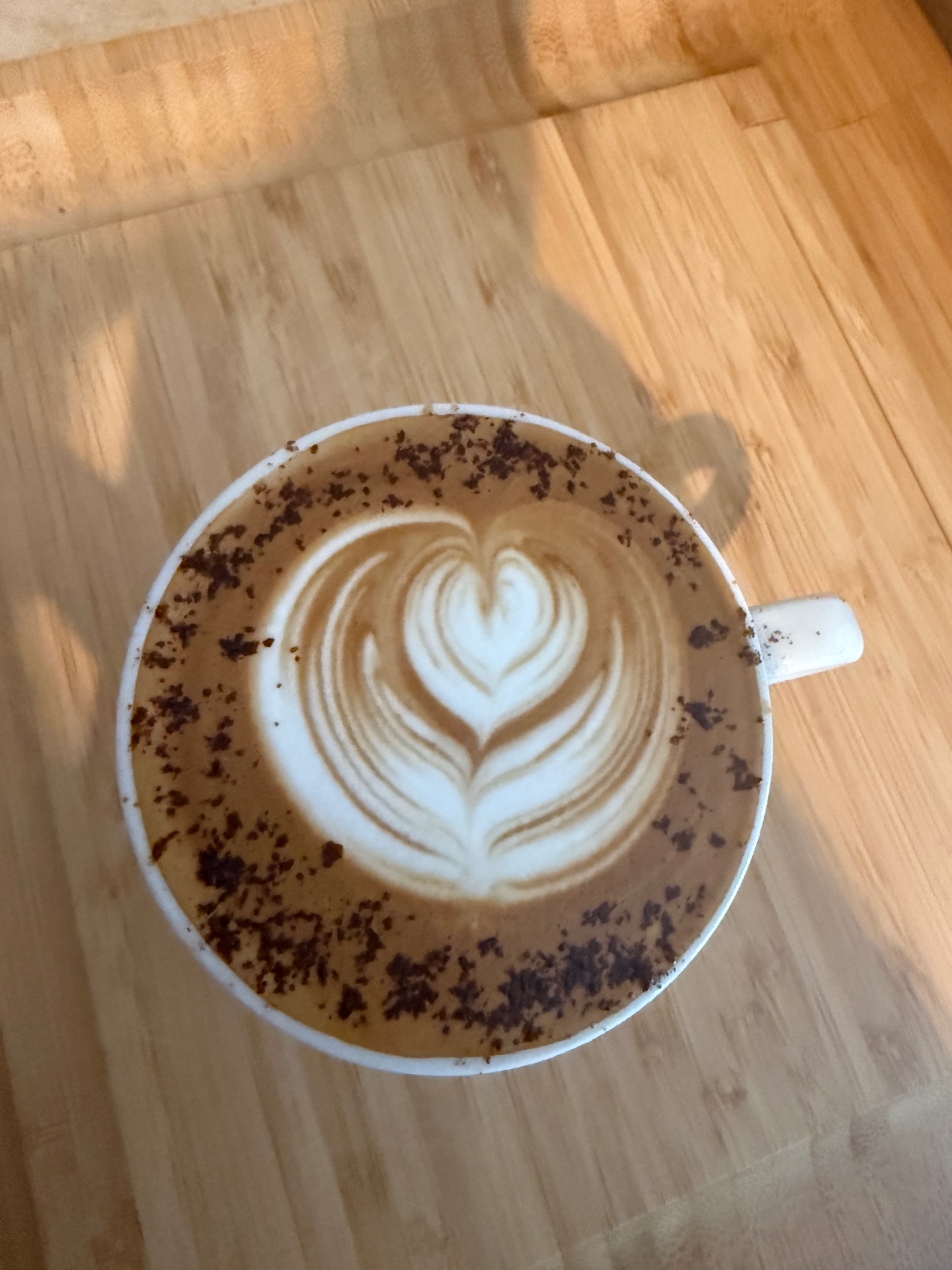 Latte art heart in a ceramic cup